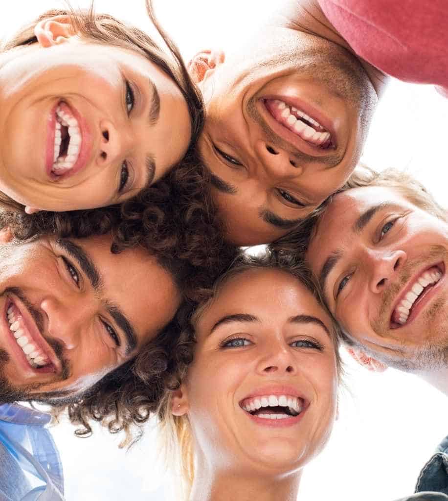 Smiling person showcasing white teeth after laser whitening treatment Wigan